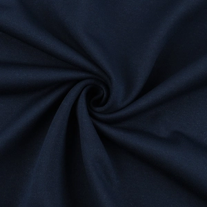 Close-up of navy blue cotton knit fabric texture with soft drapery and fine weave