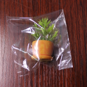 Mini planta artificial en maceta naranja para decoración de micropaisajes