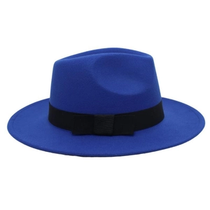 Detail of royal blue wool fedora hat featuring classic black ribbon bow and pinched crown