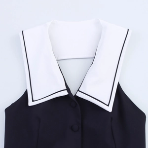 Close-up of the black sleeveless top with a contrasting white sailor collar detail