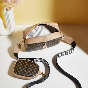 Brown circular pattern crossbody camera bag with small pouch and wide fabric strap