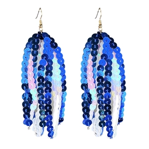 Macro shot of long tassel earrings with blue to iridescent pink round sequins and gold hooks