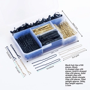 Detailed set of black and gold hair pins and elastics in a transparent storage box