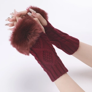 Detailed knit texture and plush fur trim on burgundy fingerless arm warmers for women