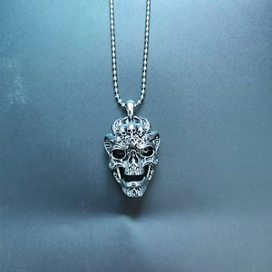 Retro hip hop skull pendant necklace in silver metal finish with a sleek bead chain