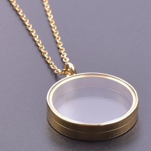 Golden round glass locket necklace with stainless steel chain and clear display