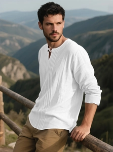 Detail of white cotton linen shirt showing Henley collar and pleated front design