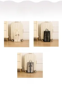 Three travel shoe bags in beige black and grey with mesh window and top handle detail