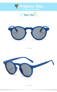 Dettaglio occhiali da sole vintage per bambini con montatura blu opaca e lenti grigie