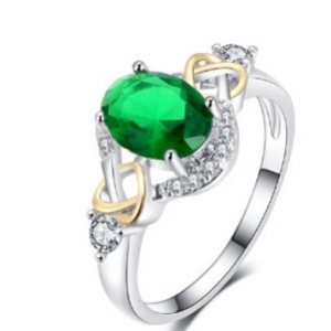Elegant two-tone ring with green oval gemstone and cubic zirconia infinity design