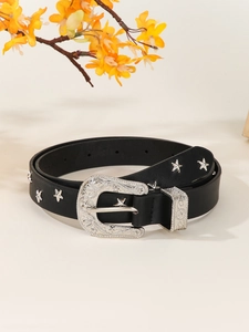 Detail of western vintage belt with large floral buckle and silver star rivets