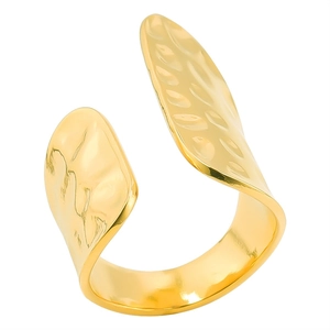 Macro detail of wide hammered texture open gold ring with irregular streamlined design