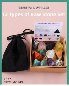 Detailed view of 12 natural raw chakra crystals in a gift box with a black pouch