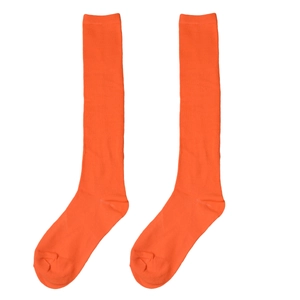 Detailed close-up of bright orange three-stripe knee-high knit socks over white background