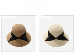 Detail of khaki and beige wide brim straw sun hats with black bow ribbon decoration