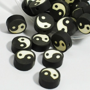 10mm black and white Tai Chi polymer clay beads scattered for DIY jewelry crafts