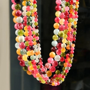 Macro shot of colorful tourmaline beaded necklace showing natural stone textures
