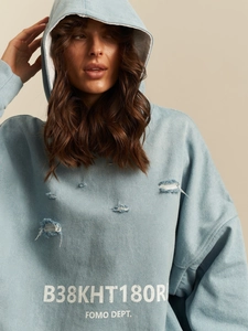 Oversize light blue hoodie with distressed ripped details and letter print for women