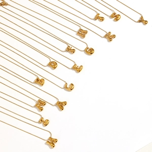 Detail of 18k gold plated alphabet pendant necklaces with high-quality metallic luster