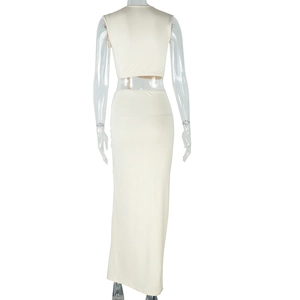 Detail view of the back of a beige two-piece knit set featuring a cropped tank and long skirt