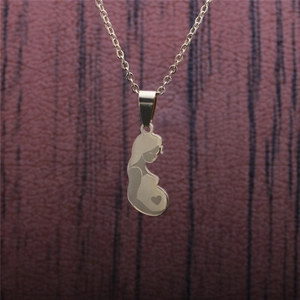 Detailed view of gold stainless steel necklace featuring a pregnant woman silhouette pendant