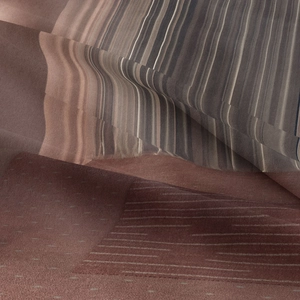 Macro shot of bohemian tapestry fabric showing striped patterns and soft texture details
