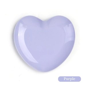 Top-down view of a purple heart-shaped stainless steel tray with polished finish