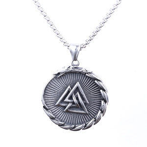 Macro shot of Viking Valknut pendant with box chain in polished stainless steel