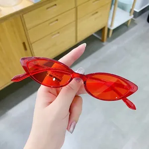 Retro red cat-eye sunglasses with translucent acetate frames and matching tinted lenses