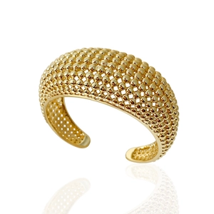 Detailed close-up of a wide gold-tone open cuff bangle with textured metal ball beads