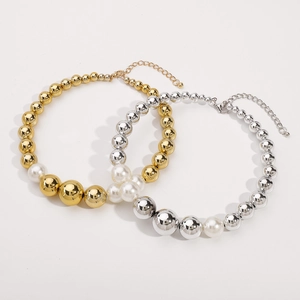 Punk style choker with gold and silver metallic beads mixed with white pearls on white background