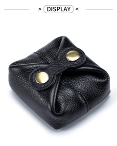 Detail of soft black pebble leather coin purse with double bronze snap buttons and stitching