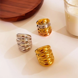Chunky metallic croissant rings in gold and silver finish with textured ribbed design