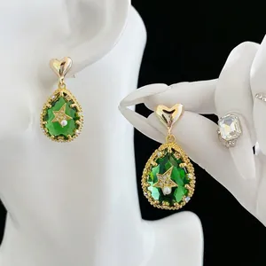 Gold plated heart stud earrings with green water drop gems and pearl star motif