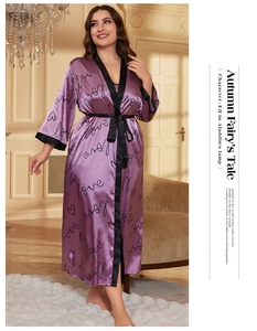 Detail of purple satin robe with black love print, lace trim and matching waist tie