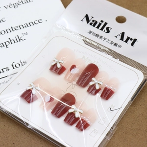 French wine red bow press-on nails with heart accents and pearl details set
