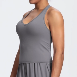 Side view of gray V-neck yoga tank top with thin straps and supportive ribbed texture