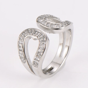 Detail of silver crisscross open ring with pavé set baguette-cut cubic zirconia stones