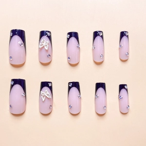 Long trapezoid press-on nails in pink and purple french design with silver butterflies