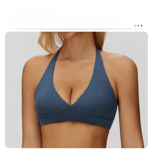 Detail of navy blue halter yoga bra with V-neckline and seamless brushed fabric