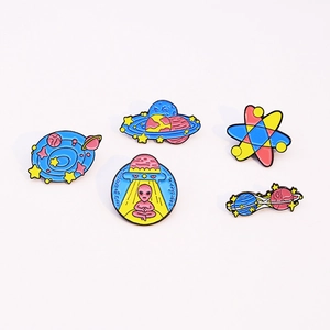 Set of five space-themed enamel pins featuring aliens, UFOs, and cosmic planets