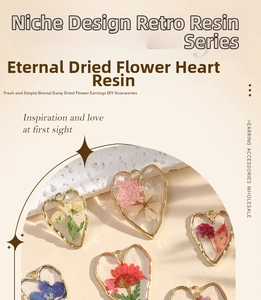 Macro shot of colorful preserved daisy petals embedded in heart-shaped resin charms