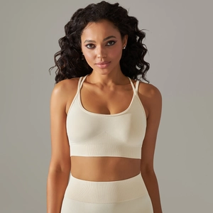 Detail of cream seamless knit sports bra with ribbed texture and high elastic fabric