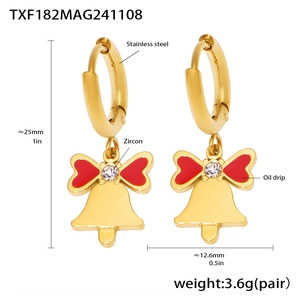 Detailed view of gold stainless steel bell earrings with red oil drip and zircon inlay