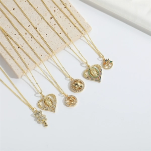 Minimalist gold necklaces with bear and heart charms on stone props in a high-quality view