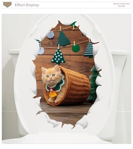 3D Christmas wall decal featuring an orange cat in a basket with a creative broken wall effect