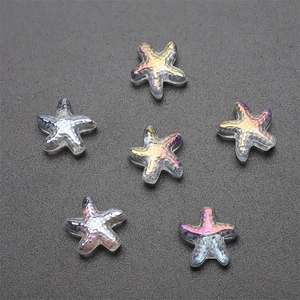 Macro view of crystal starfish charms with colorful laser iridescent finish for DIY crafts