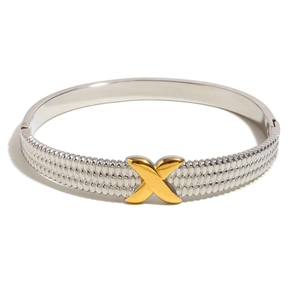 Two-tone stainless steel bangle with silver textured body and golden X-shaped buckle detail