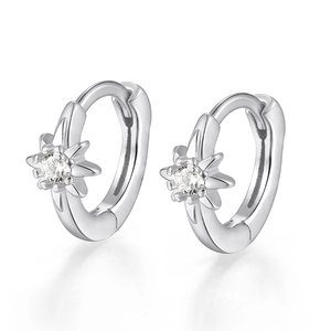 Detail of S925 sterling silver hoop earrings with star-shaped cubic zirconia setting
