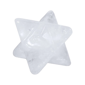 Macro shot of a clear natural quartz Merkaba star pendant with polished facets and inclusions